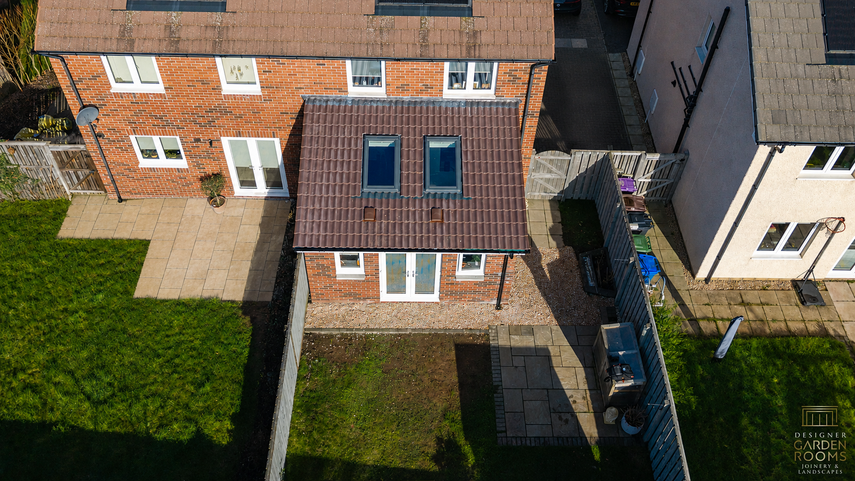 Aerial view of a pitched-roof brick house extension in Tring